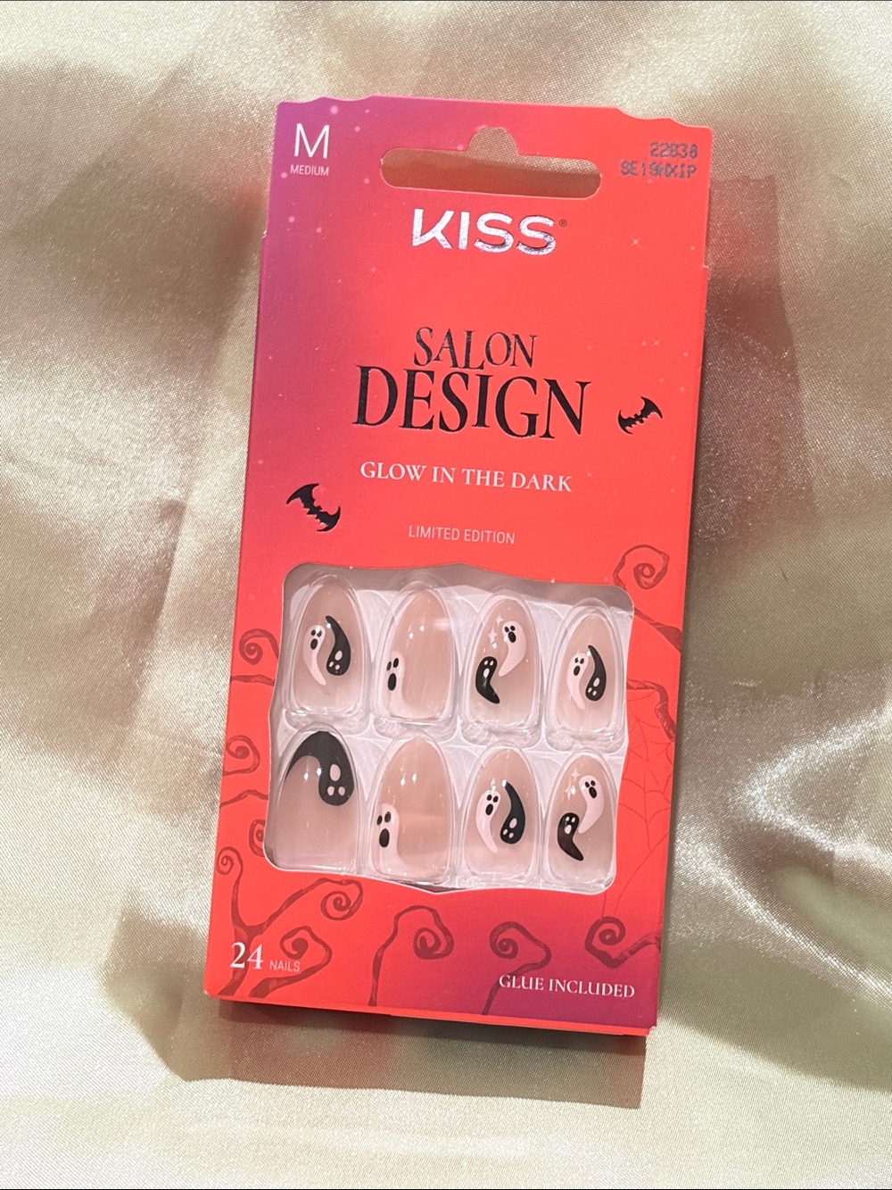 Kiss Glow-in-the-Dark Nude Nails with Black Ghosts